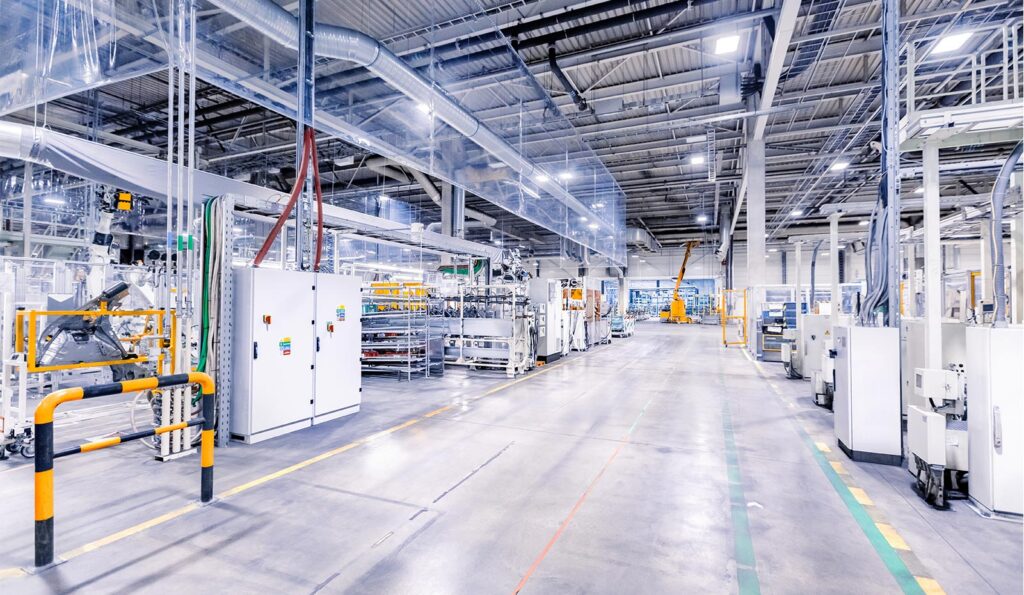 LED industrial lighting: high-bay fixtures in a modern manufacturing facility